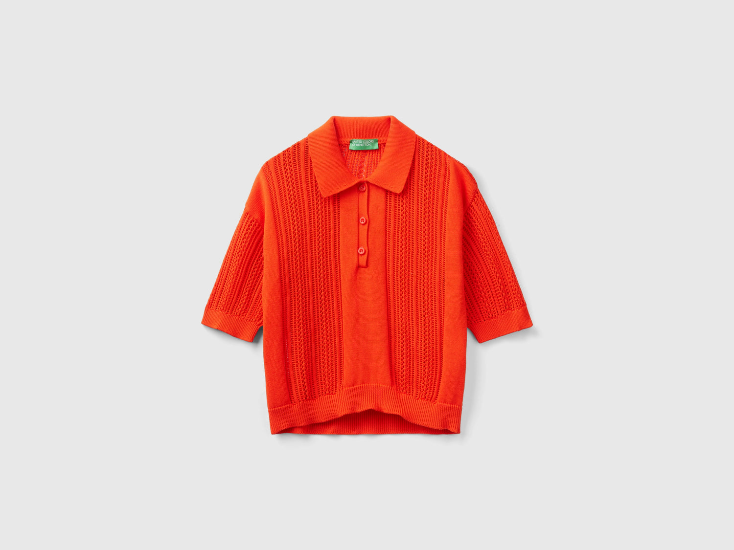 Polo in maglia crochet da donna rosso corallo | Benetton Outlet