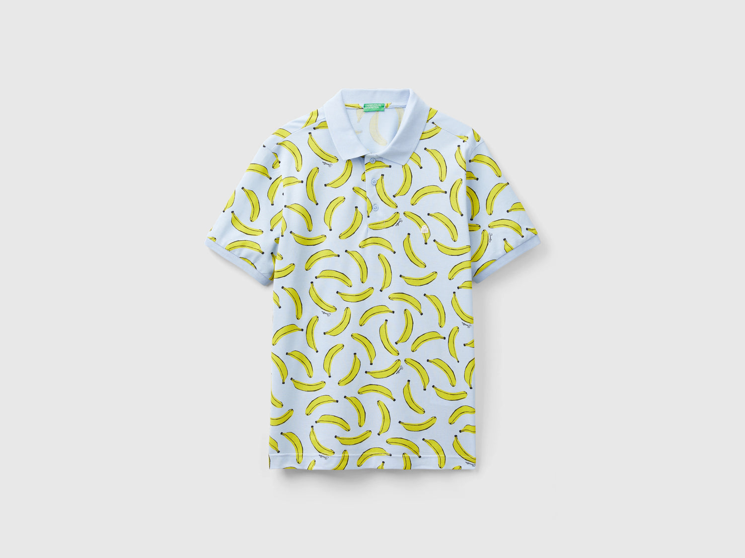 Polo de algodón con estampado de plátano da uomo celeste | Benetton Outlet