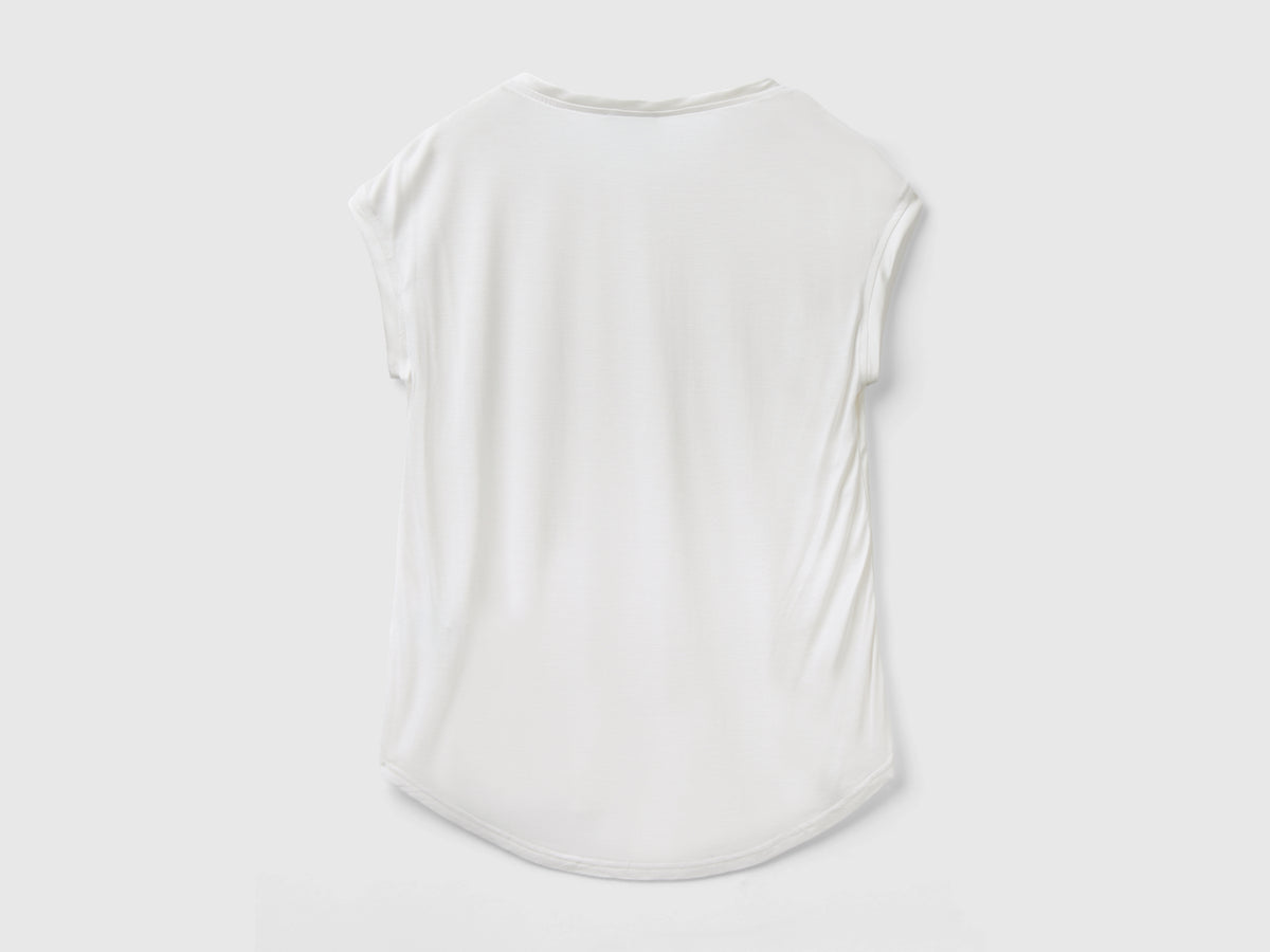 Blusa con scollo a barchetta
