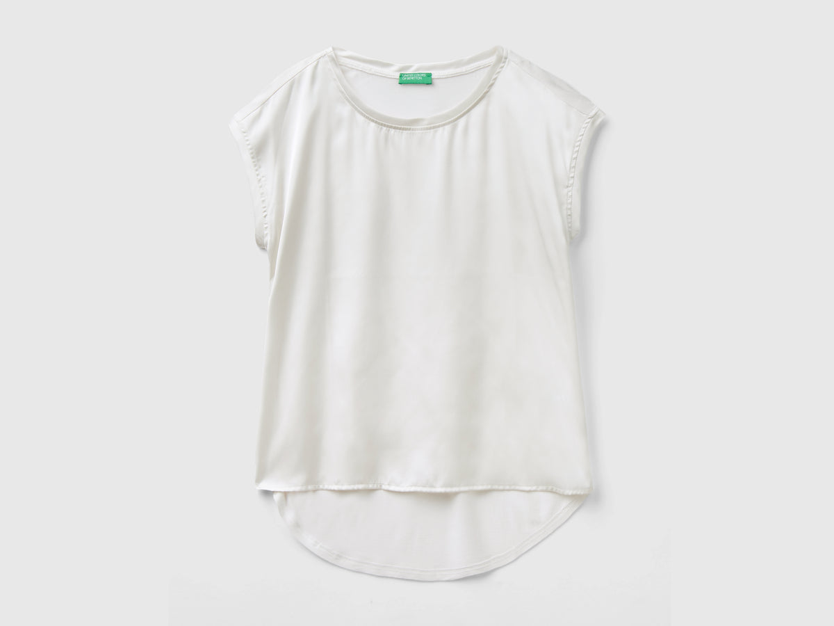 Blusa con scollo a barchetta