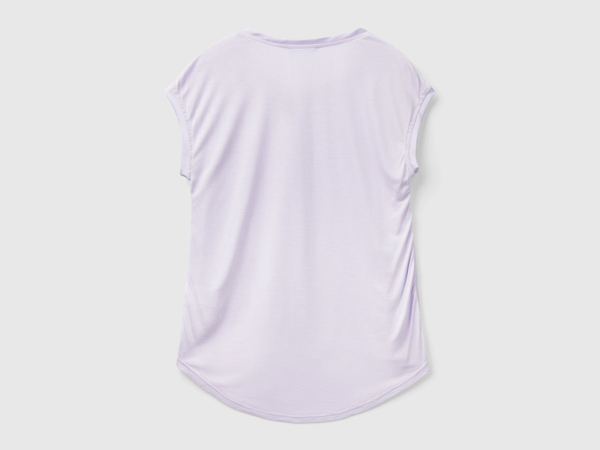 Blusa con scollo a barchetta