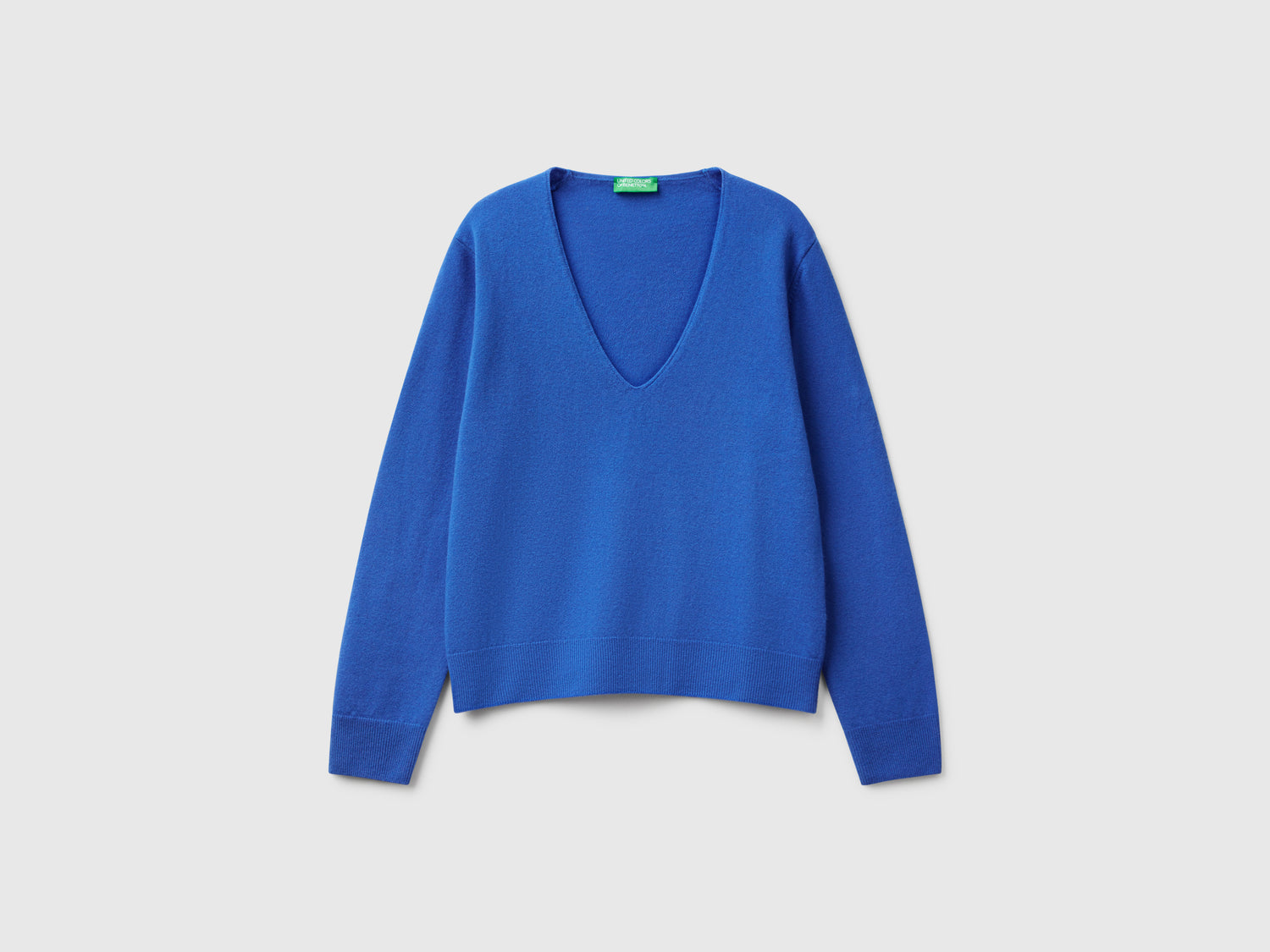 Maglione con scollo a V in pura lana Merino da donna bluette | Benetton Outlet