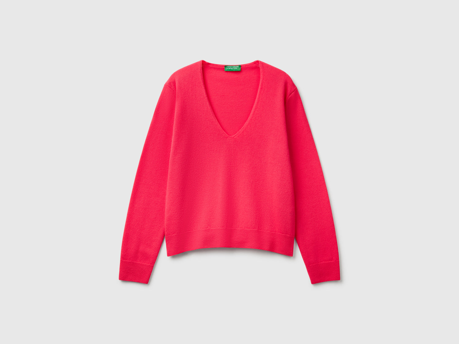 Maglione con scollo a V in pura lana Merino da donna ciclamino | Benetton Outlet