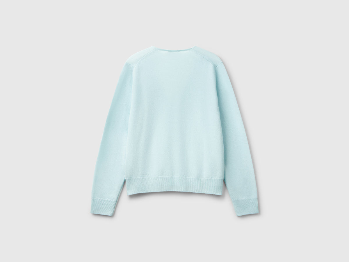Maglione con scollo a V in pura lana Merino