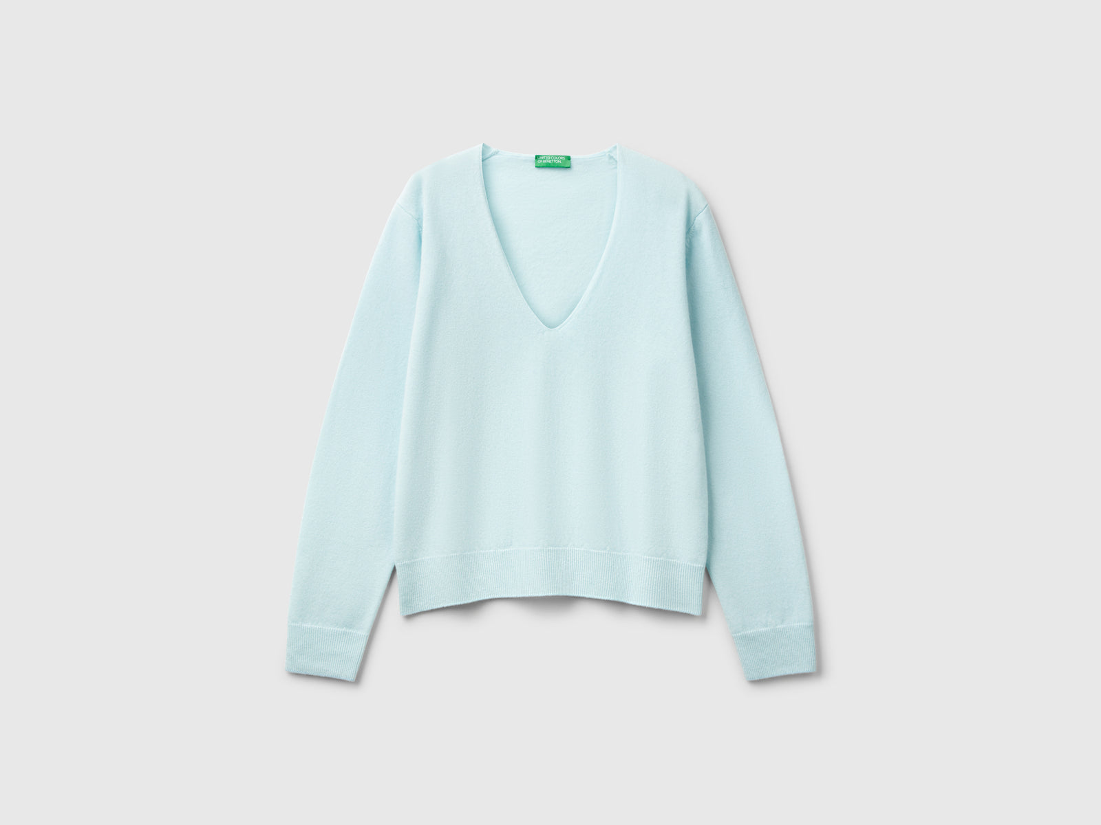 Maglione con scollo a V in pura lana Merino da donna turchese | Benetton Outlet