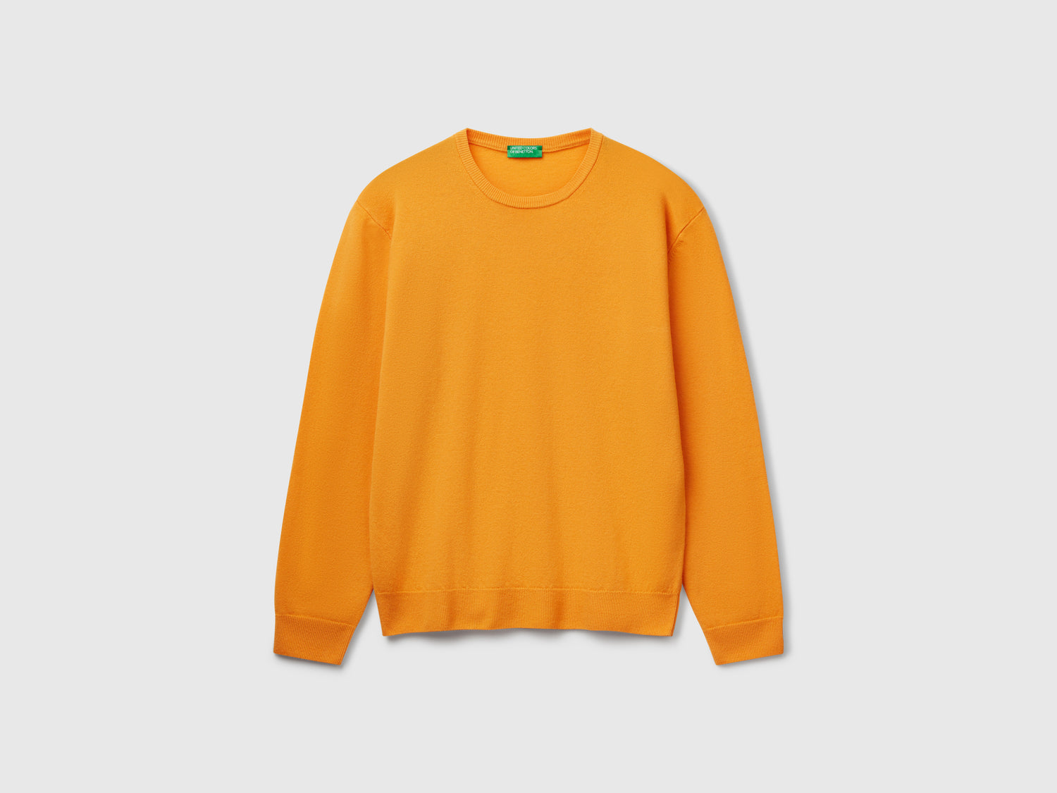 Maglia giallo ocra in pura lana Merino da uomo senape | Benetton Outlet