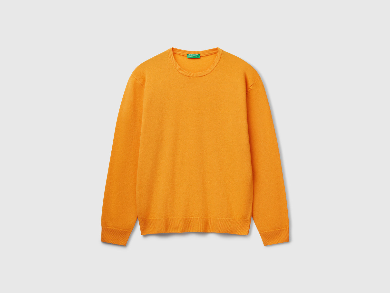 Maglia giallo ocra in pura lana Merino da uomo senape | Benetton Outlet