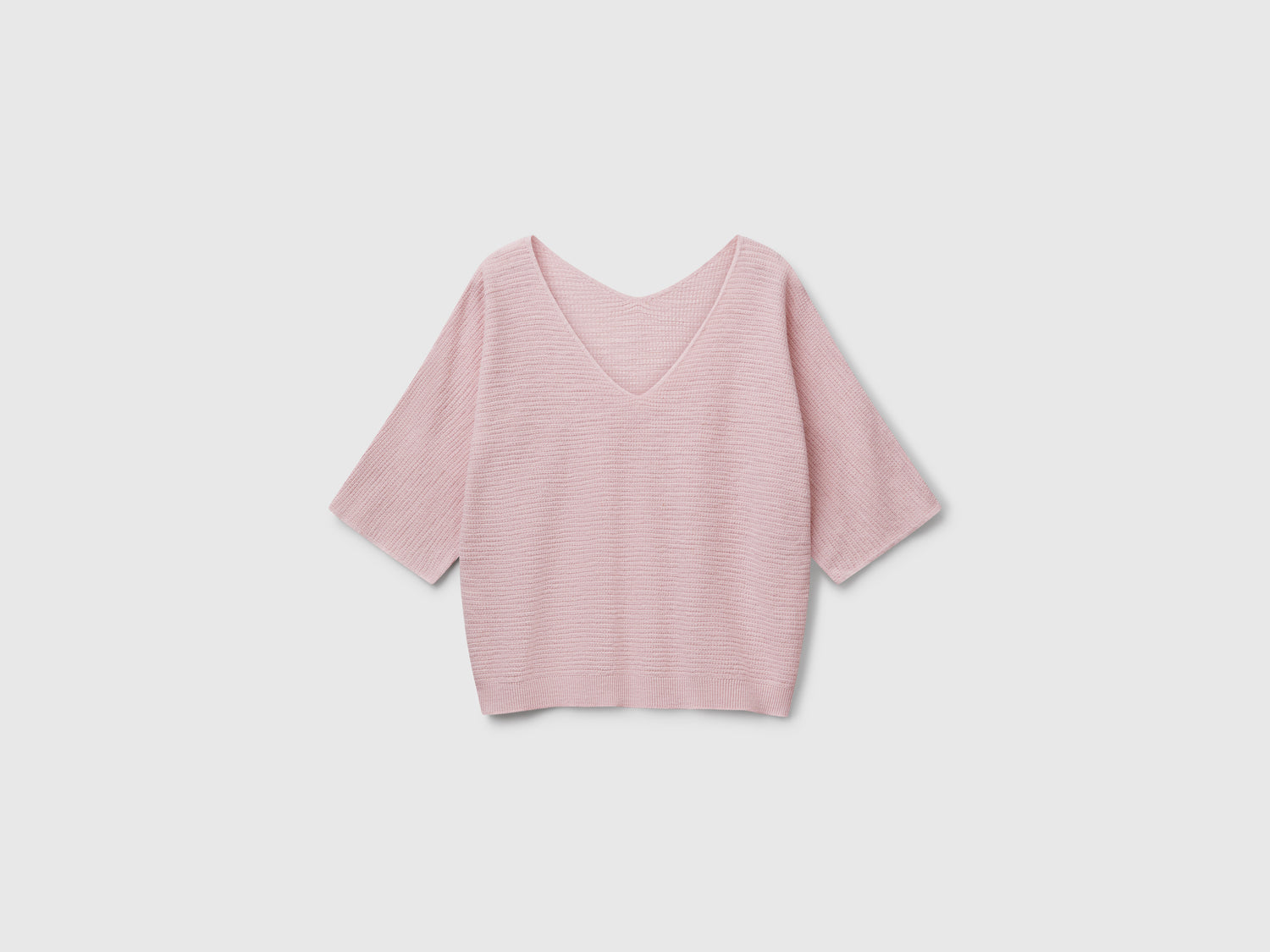Maglia reversibile cropped da donna rosa tenue | Benetton Outlet