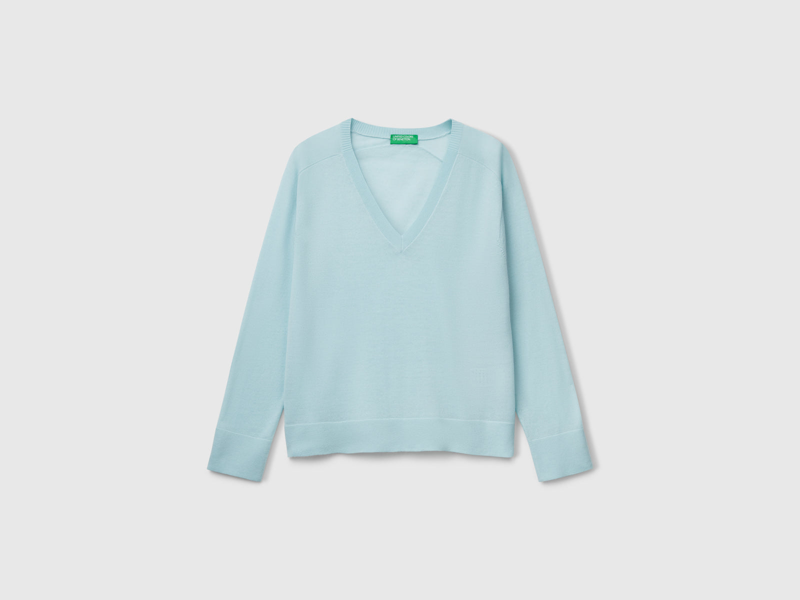 Maglia con scollo a V in pura lana Merino da donna verde acqua | Benetton Outlet