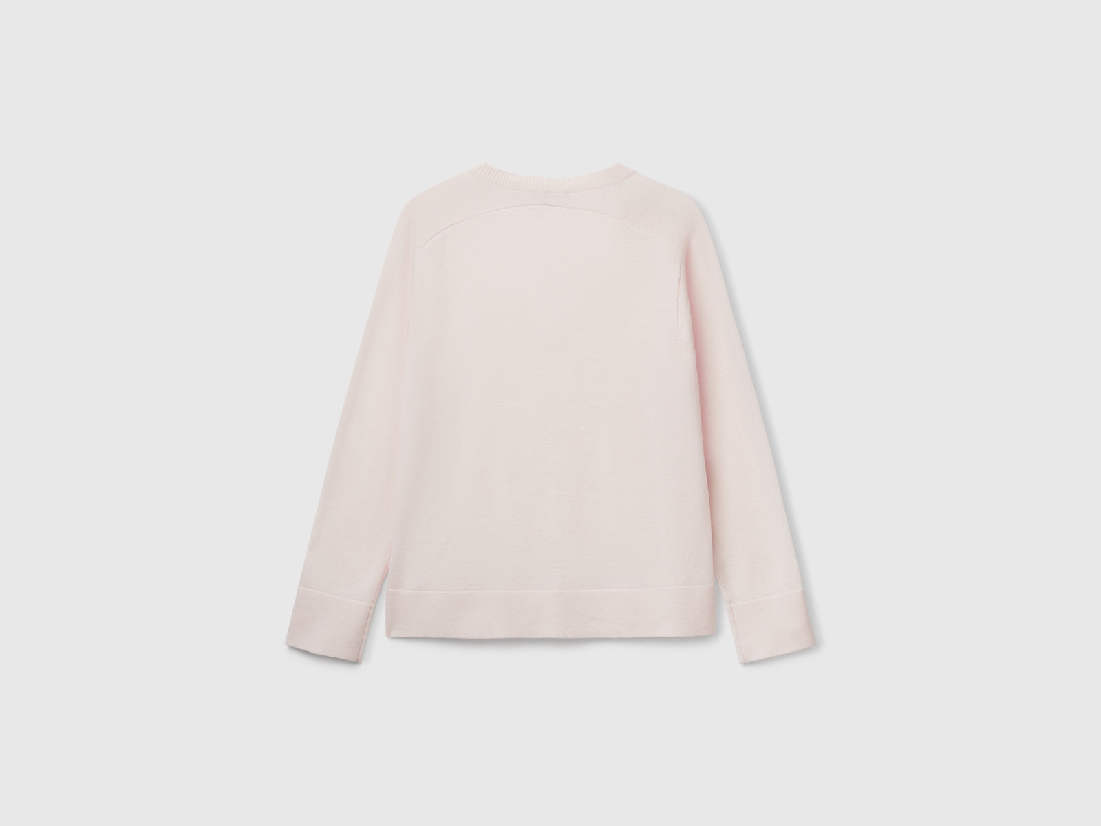 Maglia con scollo a V in pura lana Merino da donna rosa tenue 2 | Benetton Outlet