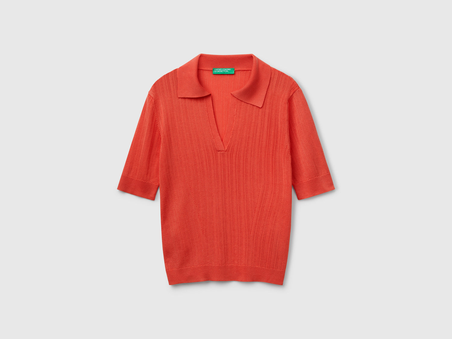 Polo in maglia a manica corta da donna arancione | Benetton Outlet
