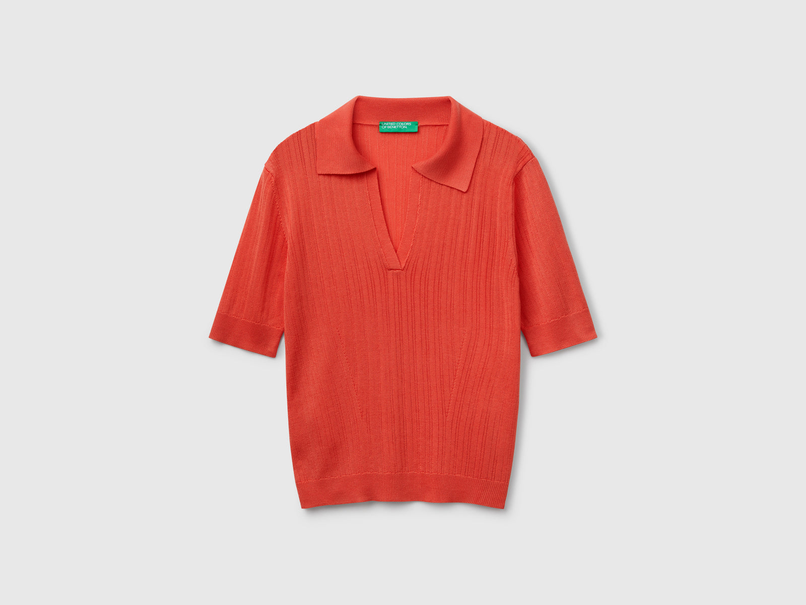 Polo in maglia a manica corta da donna arancione | Benetton Outlet