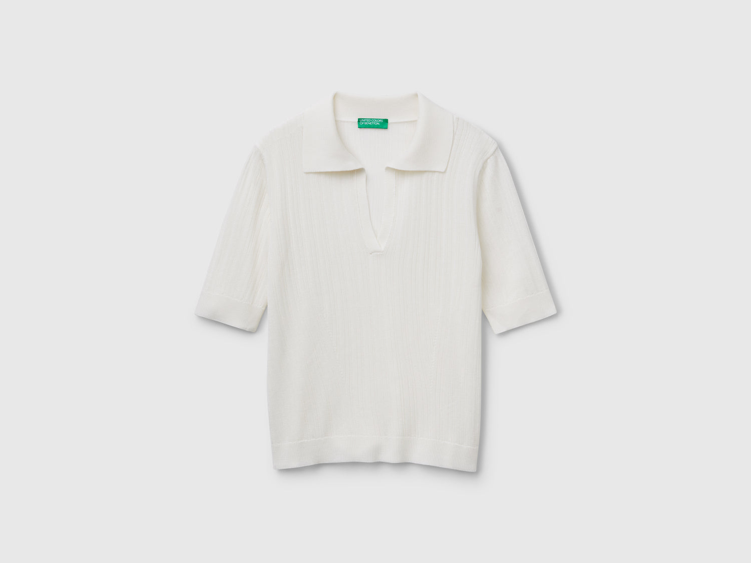 Polo in maglia a manica corta da donna bianco | Benetton Outlet