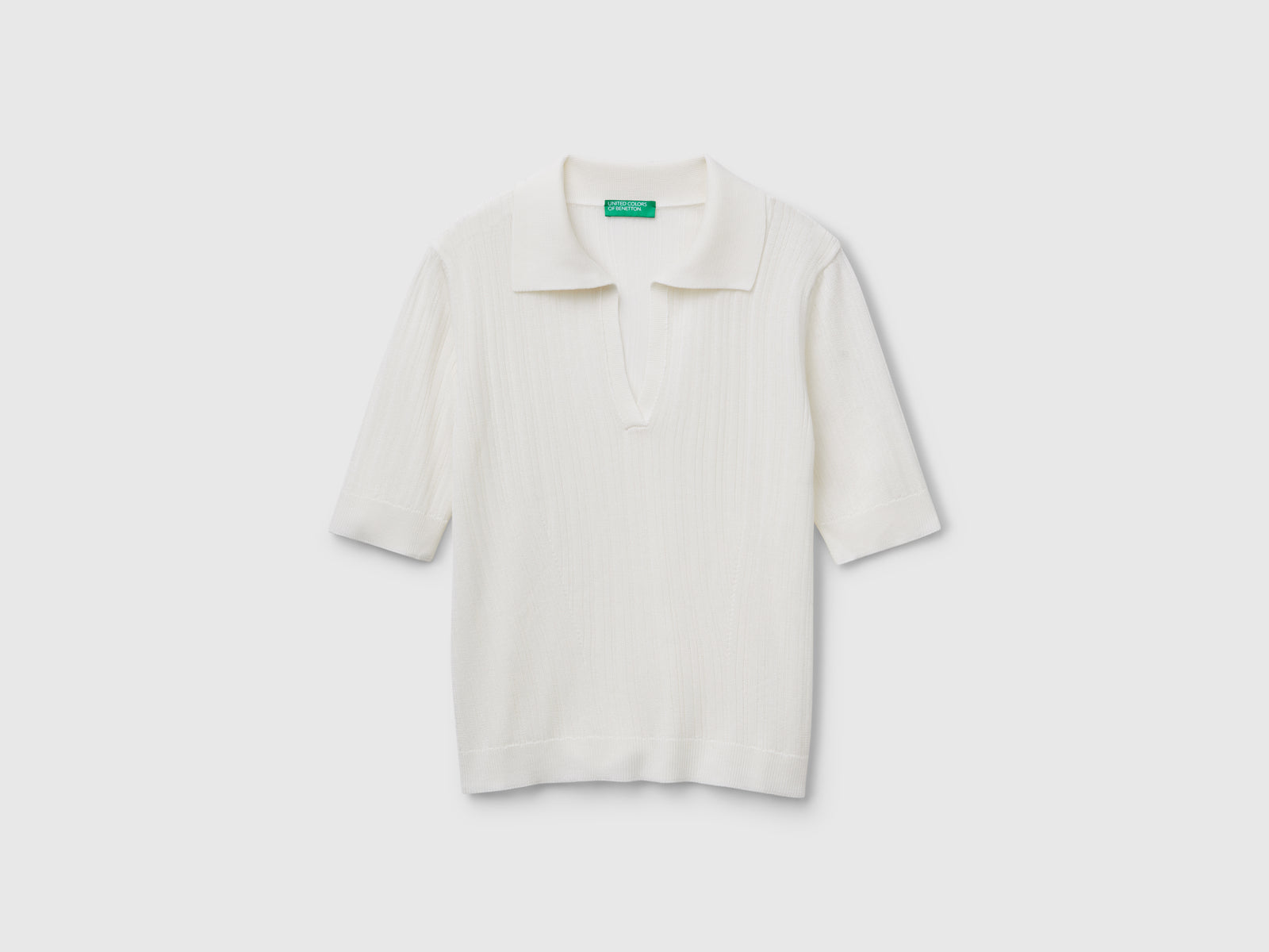 Polo in maglia a manica corta da donna bianco | Benetton Outlet