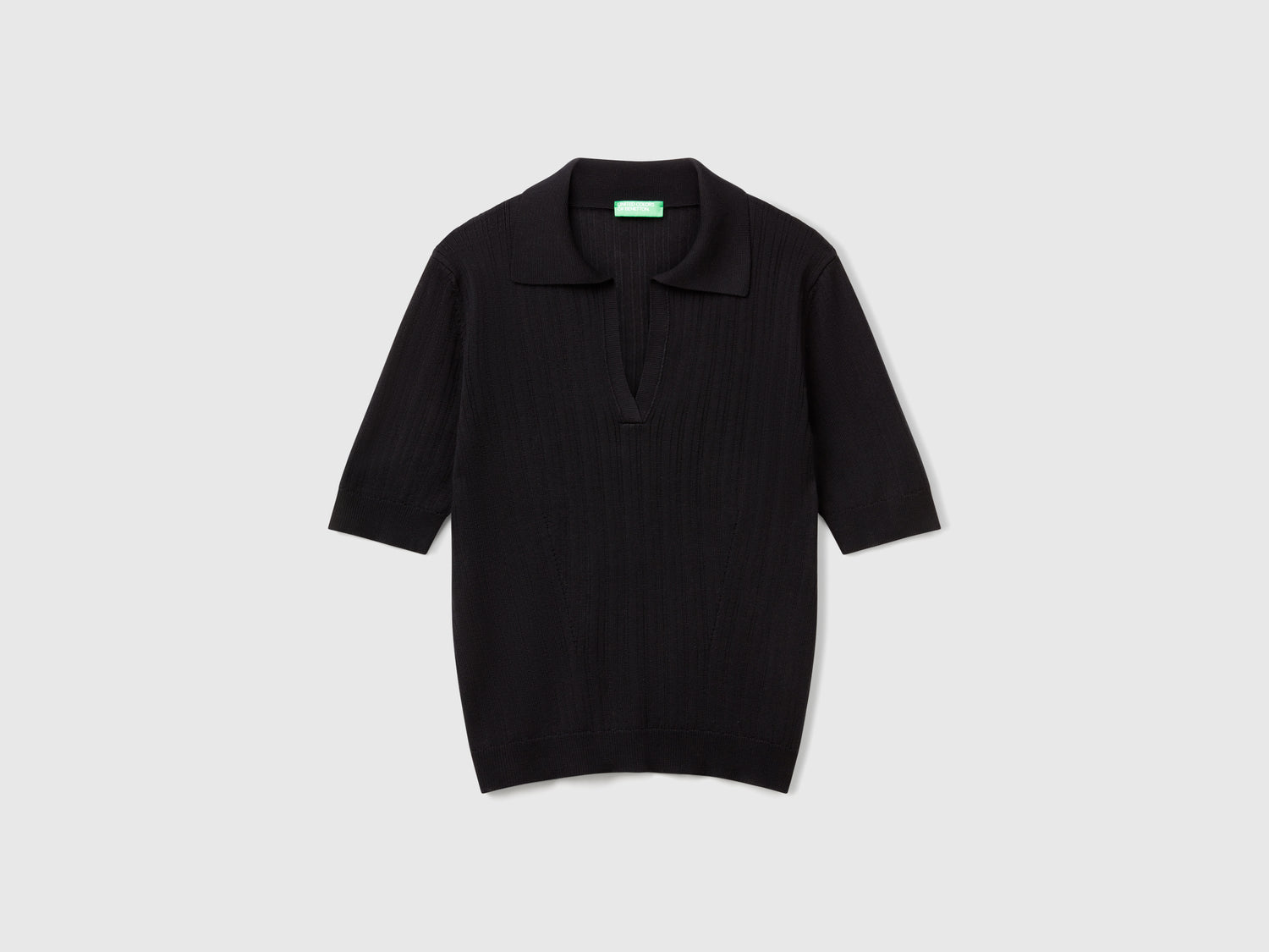 Polo in maglia a manica corta da donna nero | Benetton Outlet