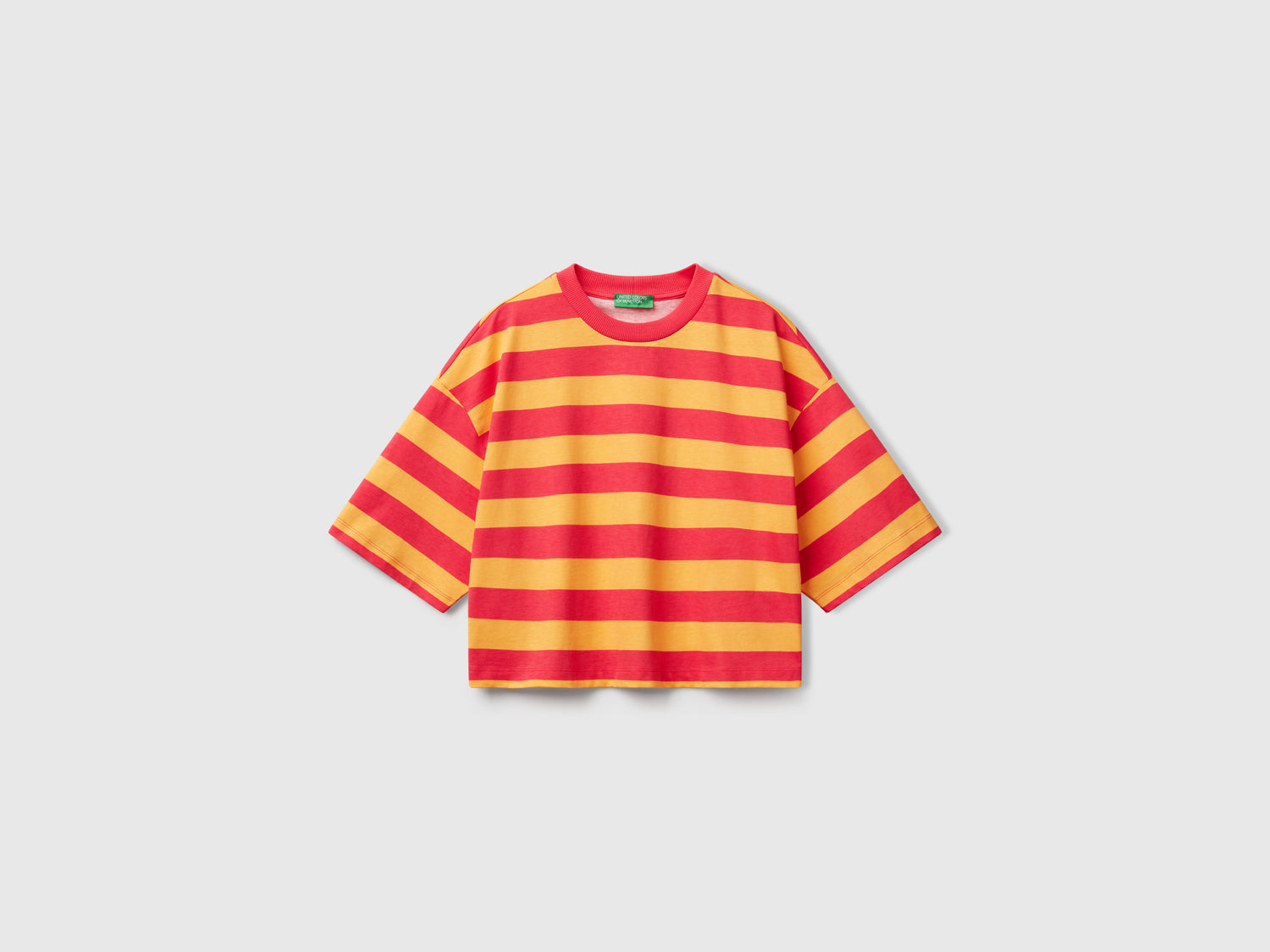 Orange and fuchsia striped T-shirt da donna arancione | Benetton Outlet