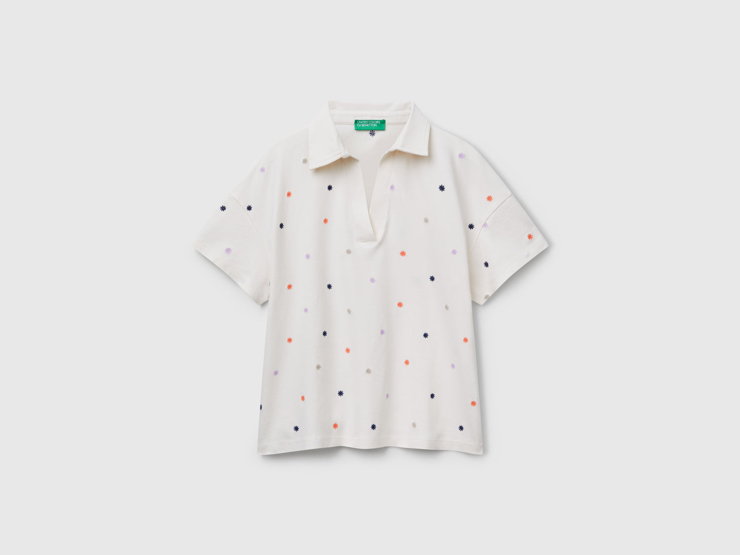 Polo con ricamo fiori da donna bianco panna | Benetton Outlet