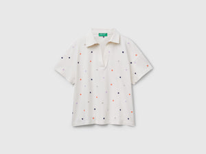 Polo con ricamo fiori