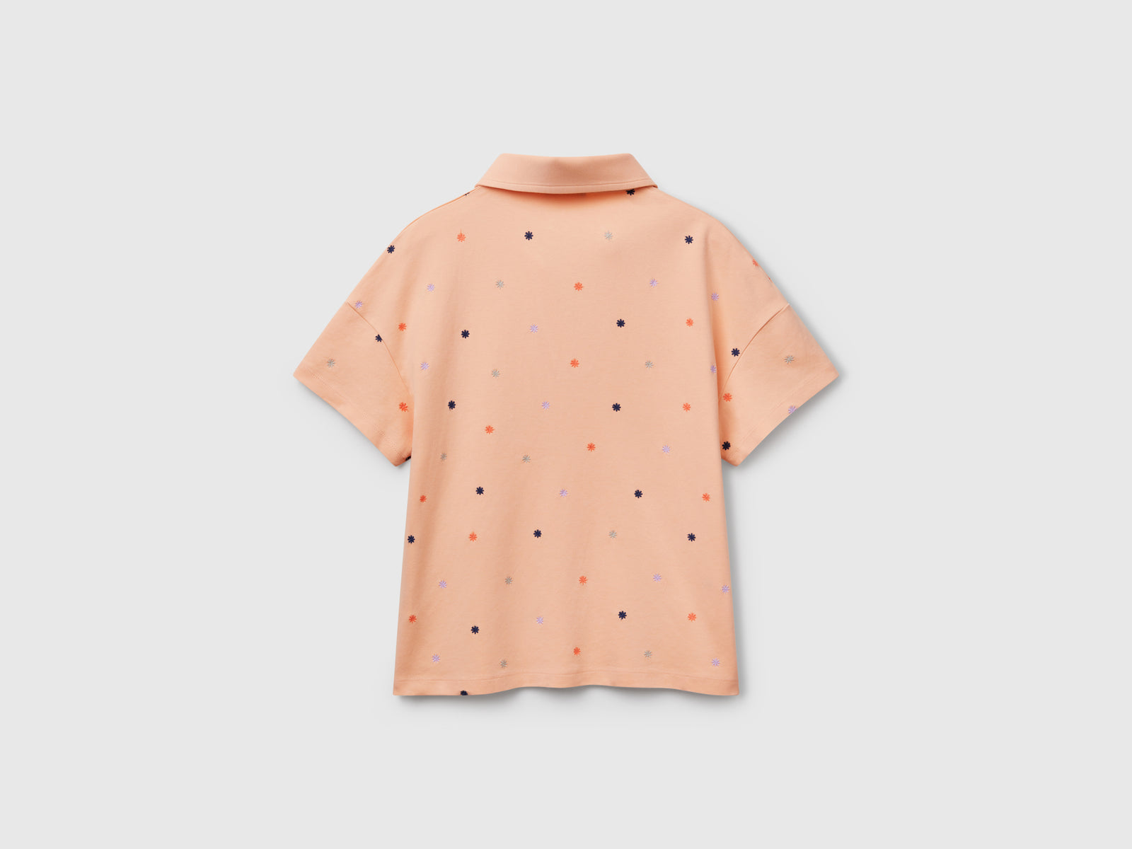 Polo con ricamo fiori da donna pesca 2 | Benetton Outlet