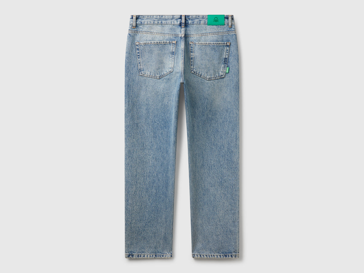 Jeans regular fit con rotture
