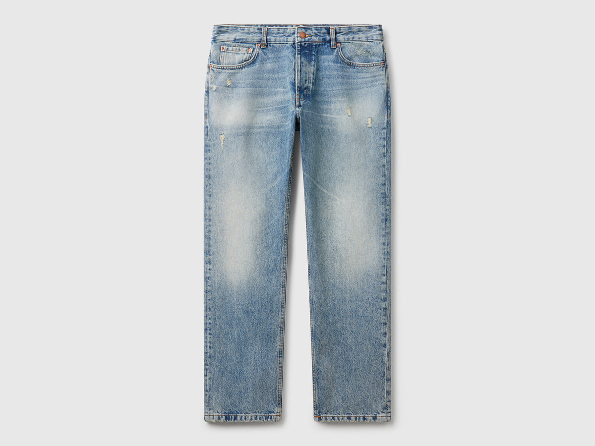 Jeans regular fit con rotture
