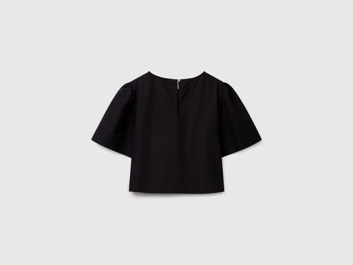 Blusa svasata con manica volant