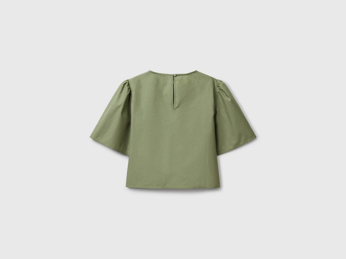 Blusa svasata con manica volant