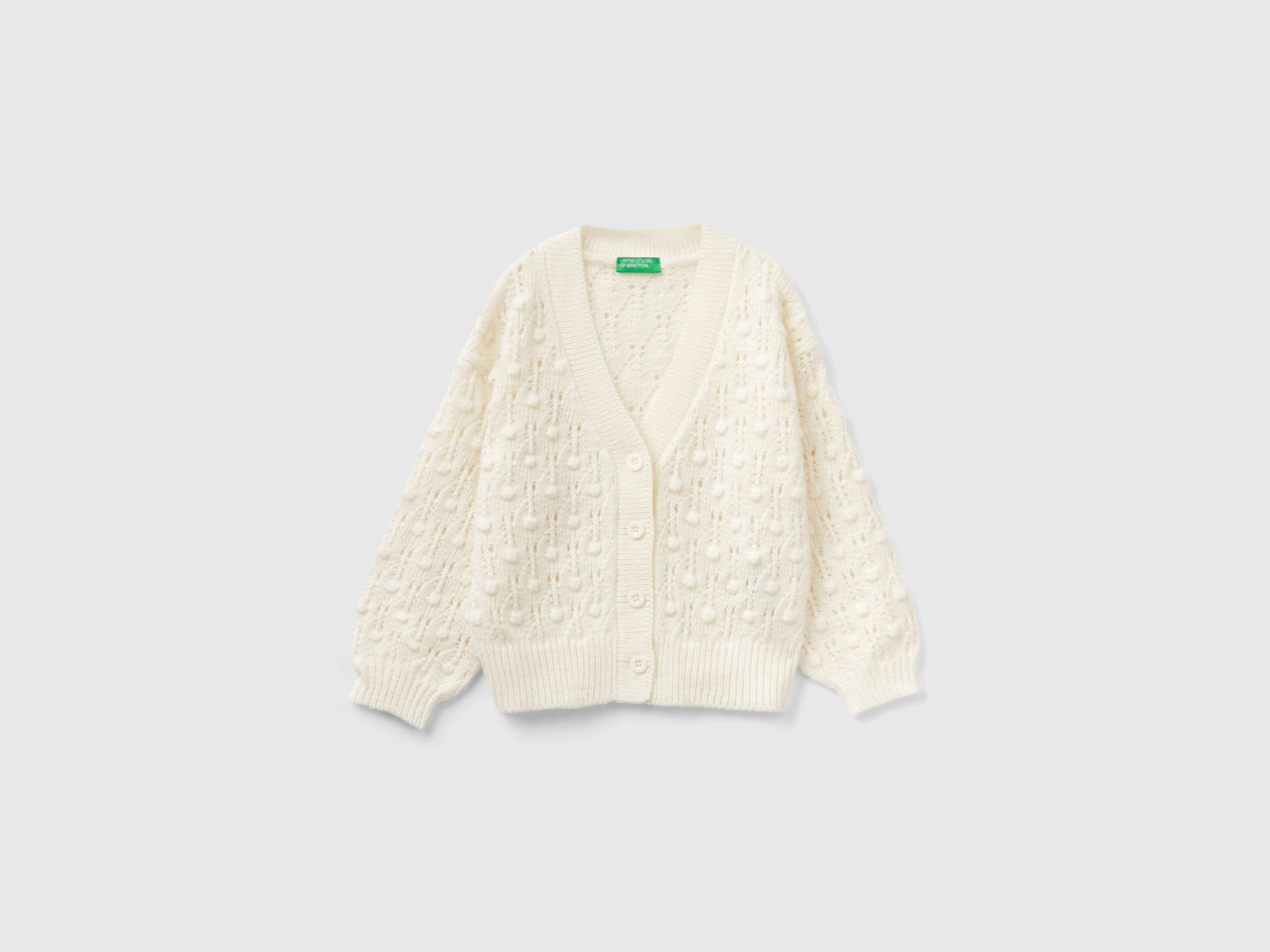 Cardigan lavorato con bottoni da bimba bianco | Benetton Outlet