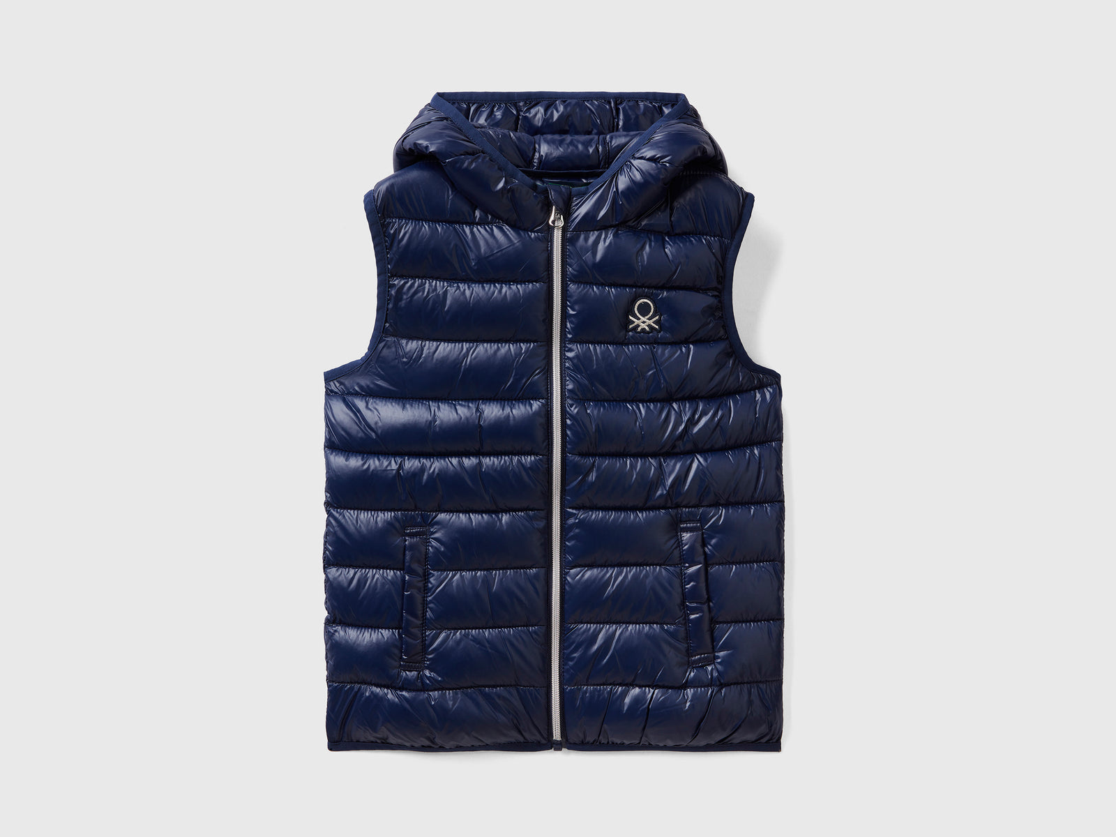Chaleco acolchado con capucha da bambina blu scuro | Benetton Outlet
