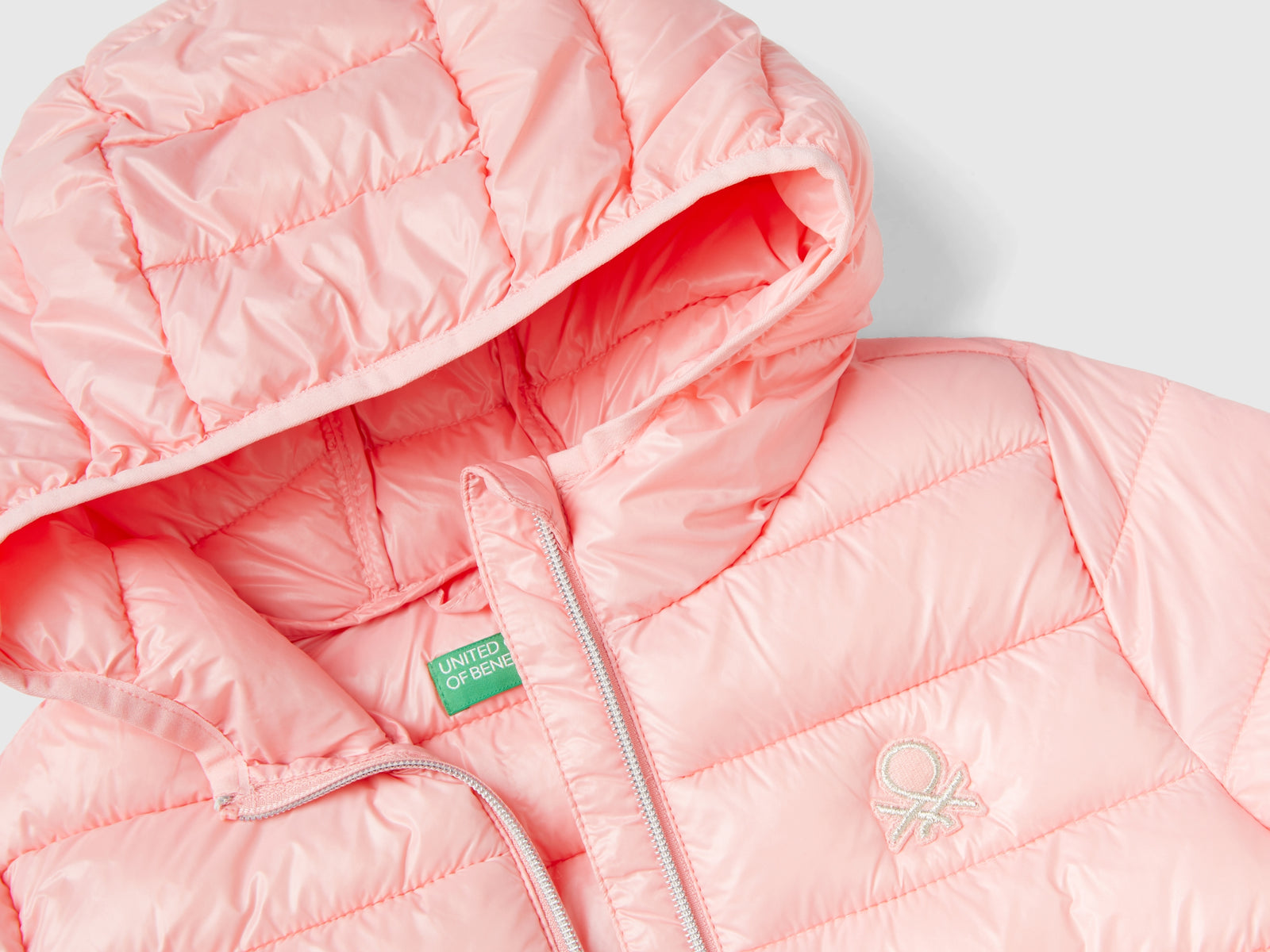 Chaqueta acolchada con capucha da bambina rosa 3 | Benetton Outlet