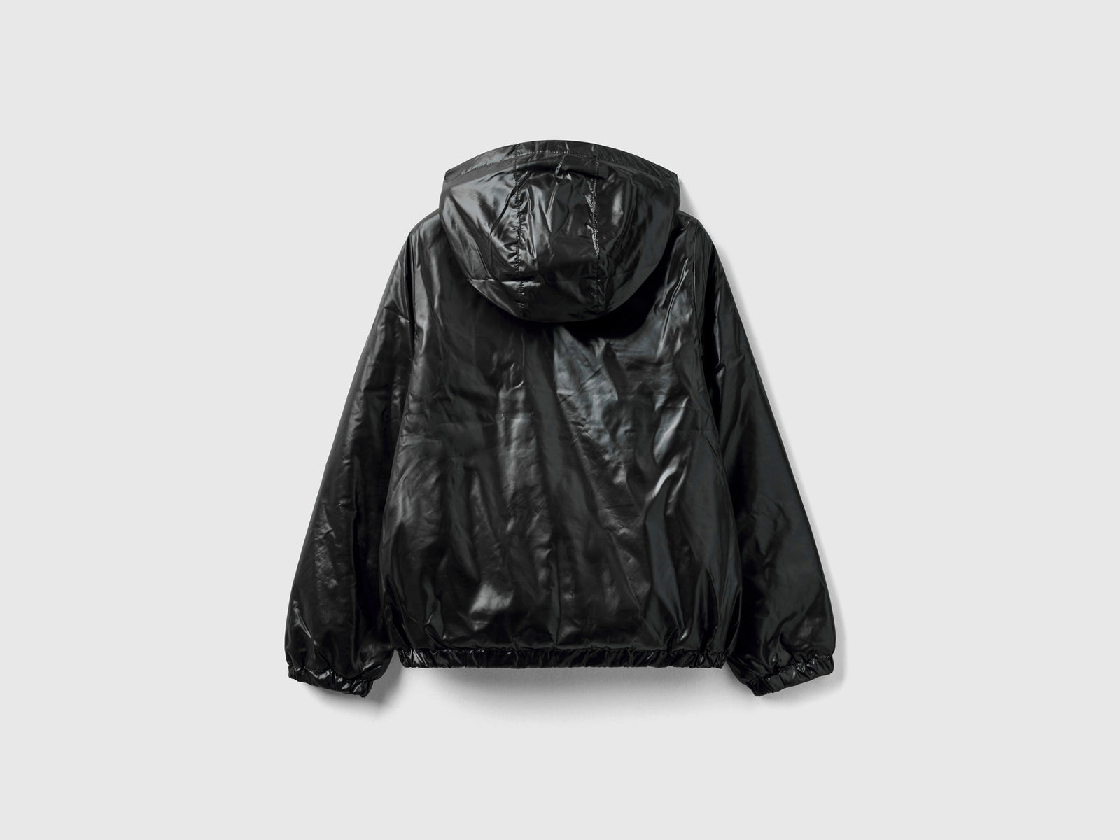 Giubbino lucido con zip e cappuccio da bambina nero 2 | Benetton Outlet