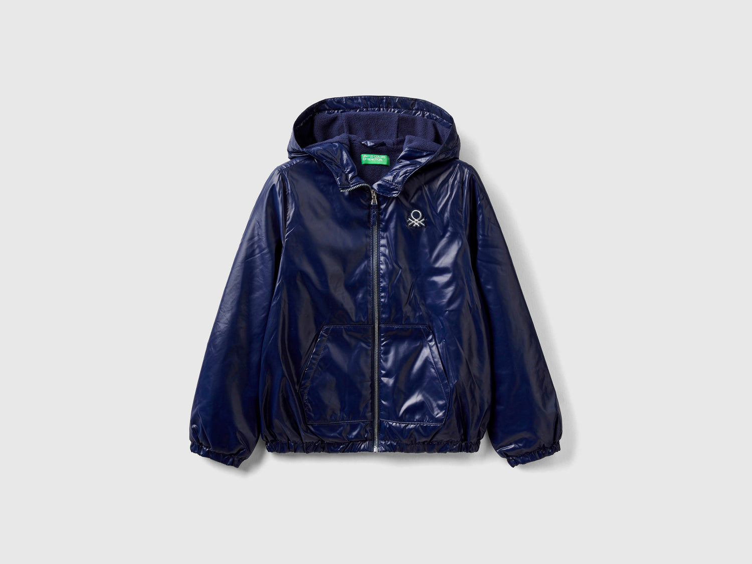 Giubbino lucido con zip e cappuccio da bambina blu scuro | Benetton Outlet