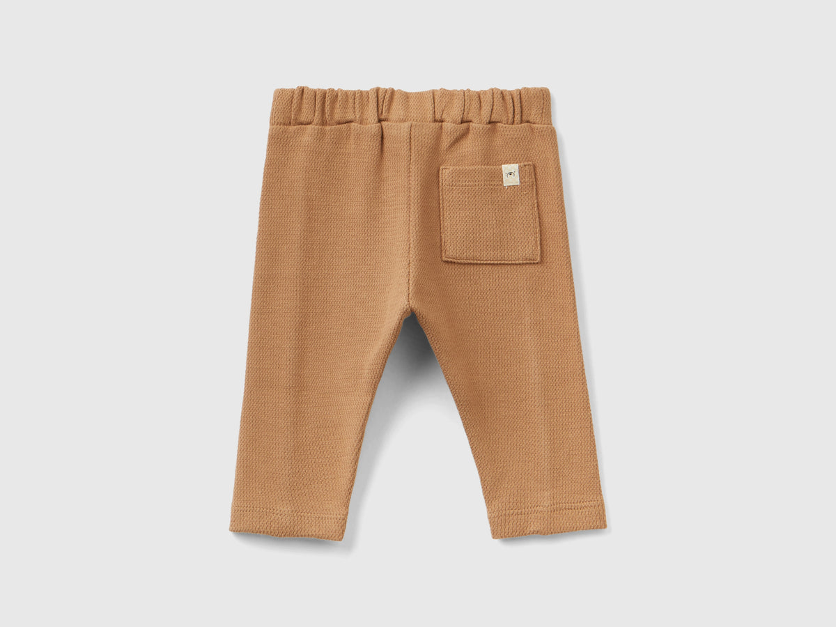 Pantaloni con nodo in vita