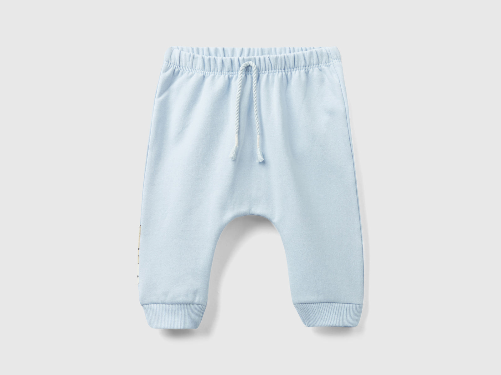 Pantalón sudadera cálido con bolsillo da neonato celeste | Benetton Outlet