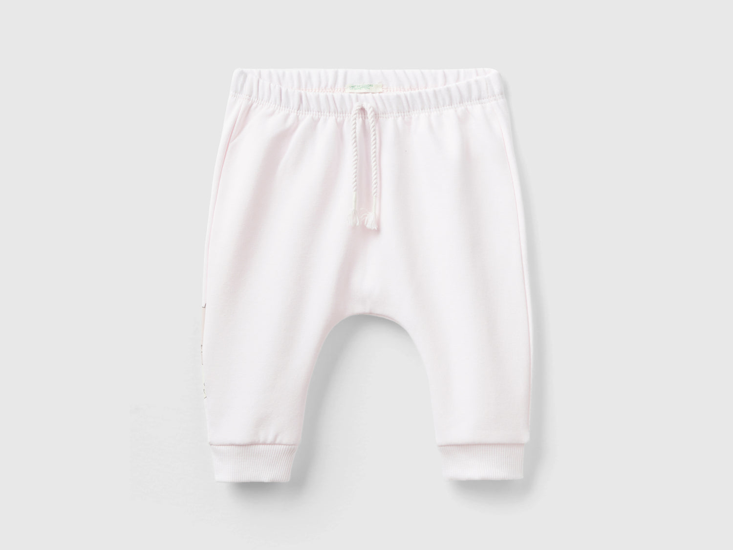 Pantalón sudadera cálido con bolsillo da neonato rosa tenue | Benetton Outlet