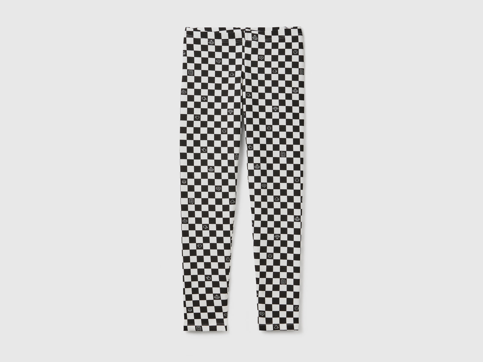 Leggings a scacchi in cotone stretch da bambina nero | Benetton Outlet