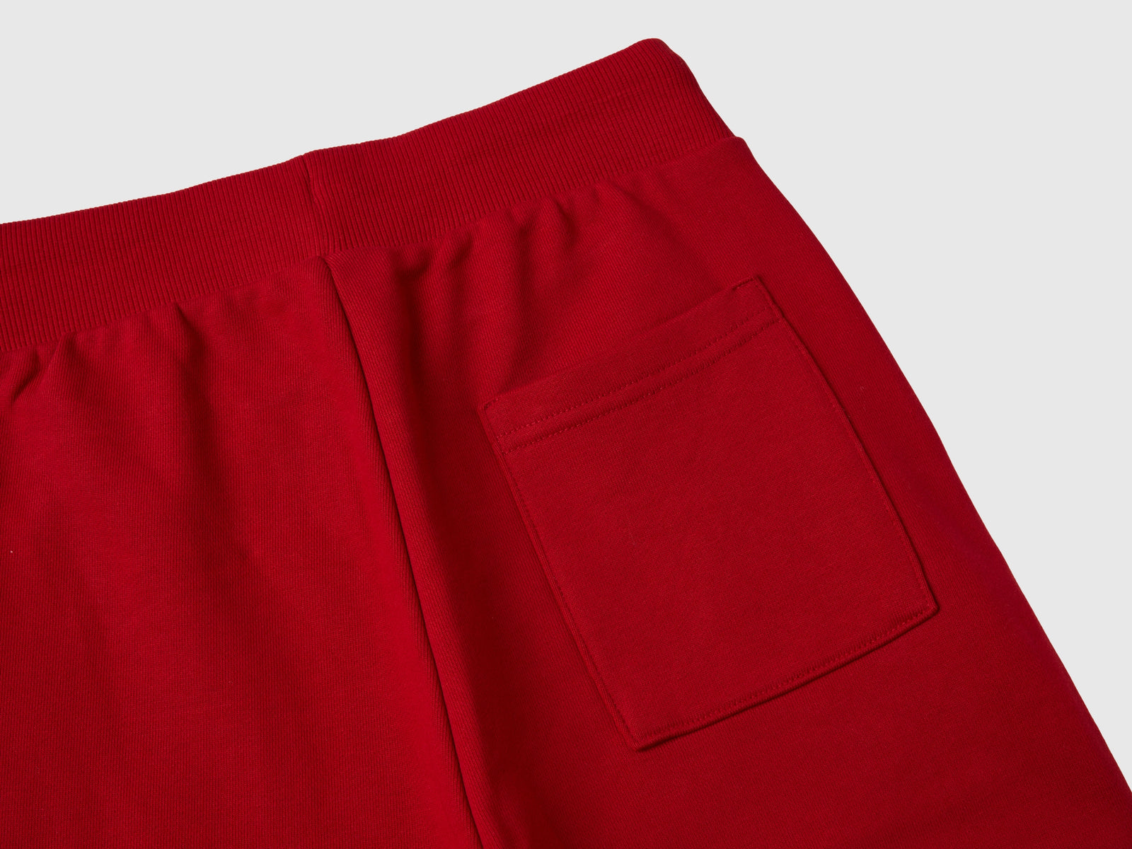 Joggers rosa e rossi da bambino rosso mattone 3 | Benetton Outlet