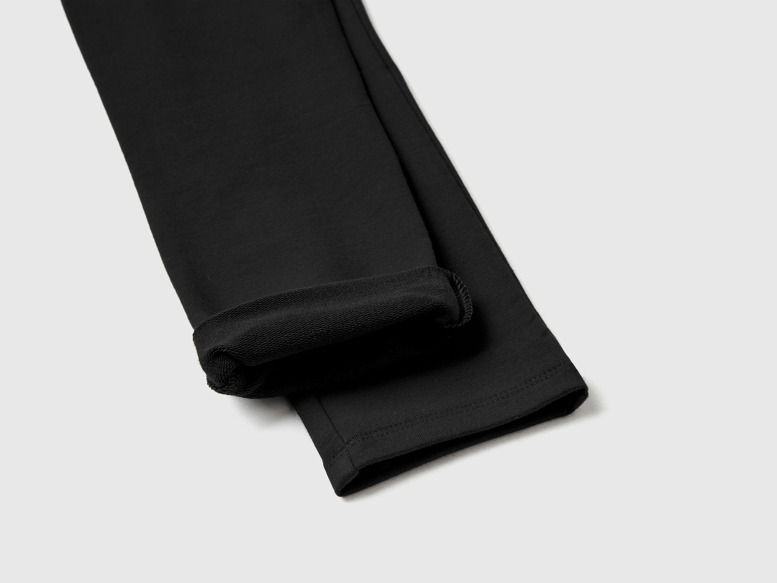 Leggings in felpa stretch da bambina nero 2 | Benetton Outlet
