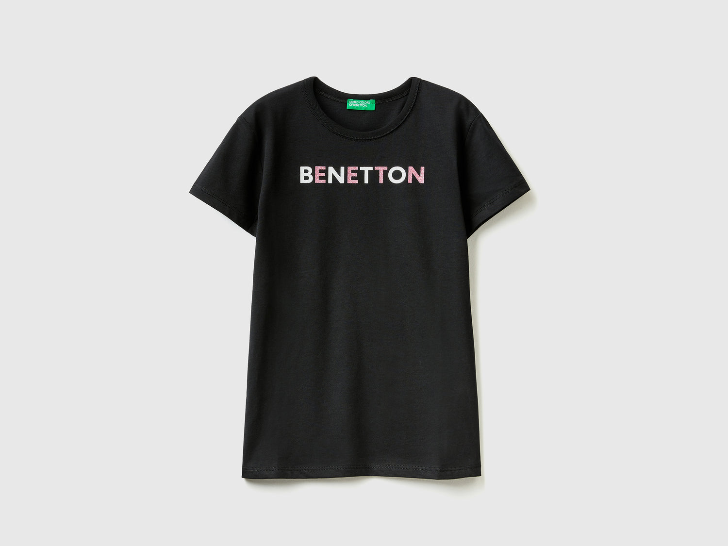 T-shirt con logo glitter in cotone bio da bambina nero | Benetton Outlet