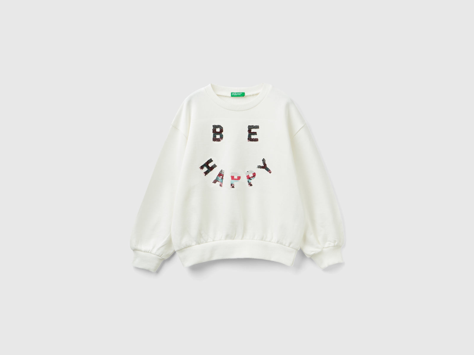 Felpa con paillettes reversibili da bambina bianco panna 3 | Benetton Outlet
