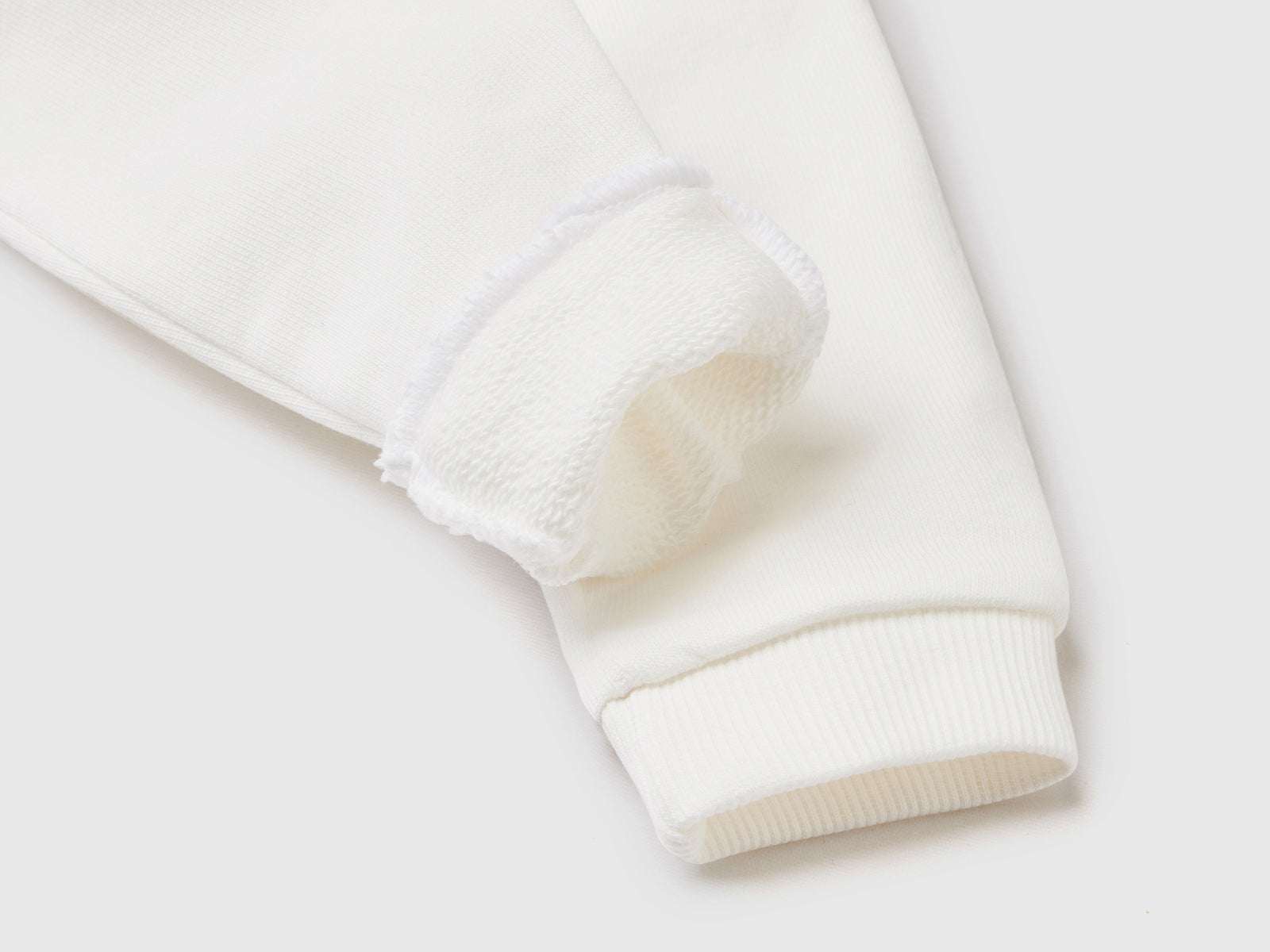Pantaloni in felpa di cotone biologico da neonato bianco panna 2 | Benetton Outlet