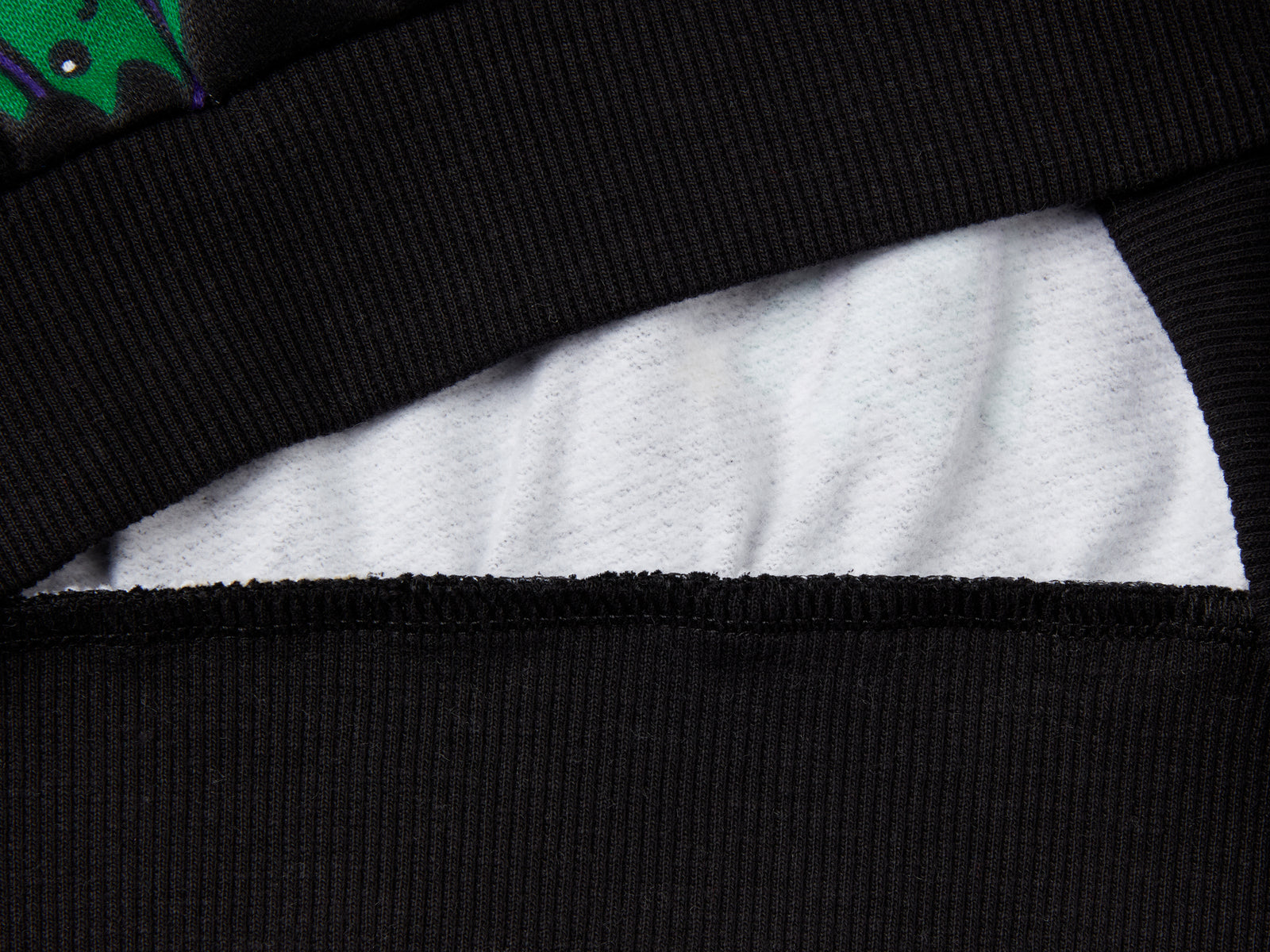 Calda felpa natalizia over fit da bambina nero 2 | Benetton Outlet