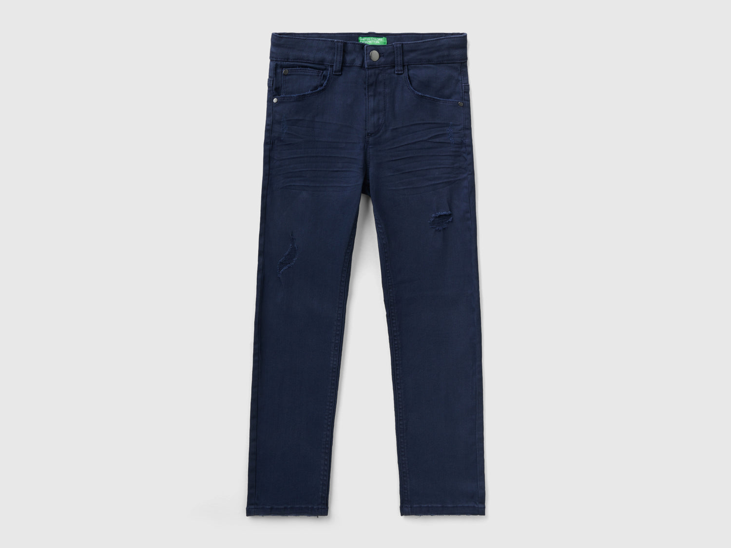 Jeans stretch con rotture da bambino blu scuro | Benetton Outlet