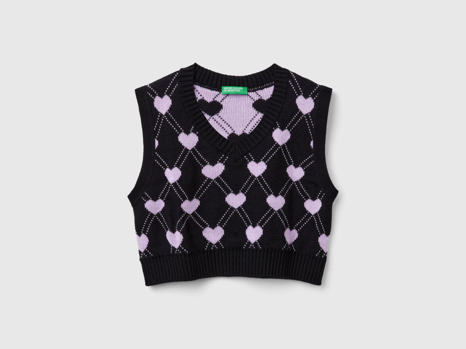 Gilet cropped con motivo cuori da bambina nero | Benetton Outlet