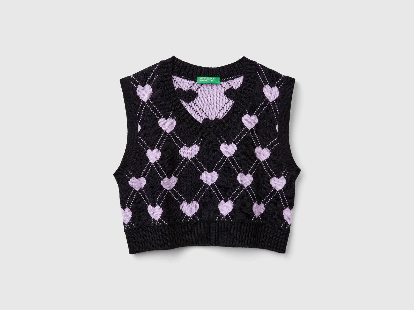 Gilet cropped con motivo cuori da bambina nero | Benetton Outlet