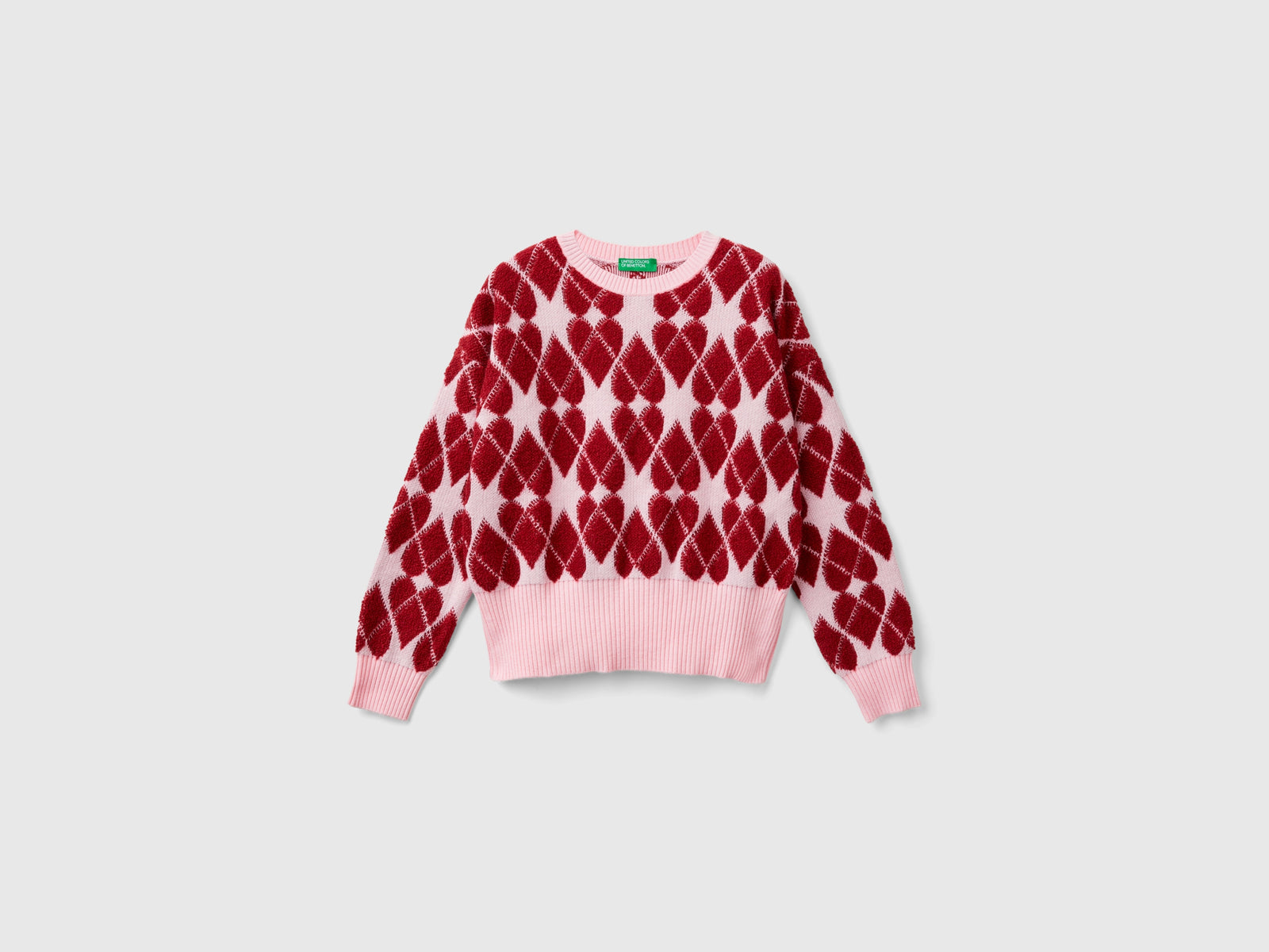 Maglia a cuori jacquard da bambina rosa | Benetton Outlet