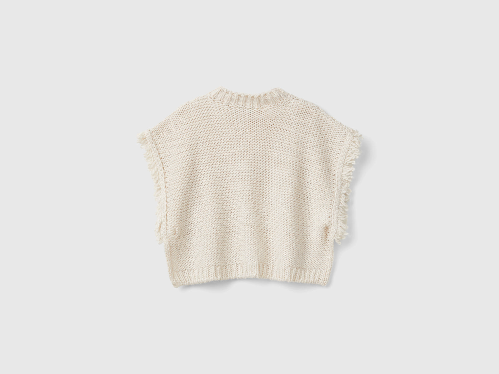 Mantella lavorata in misto lana da bimba bianco panna 2 | Benetton Outlet