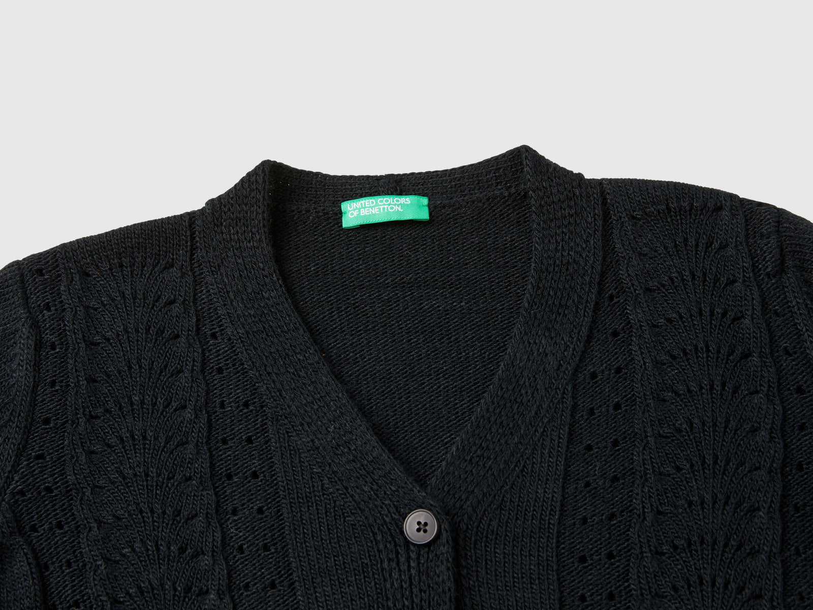 Cardigan con trafori da bambina nero 3 | Benetton Outlet