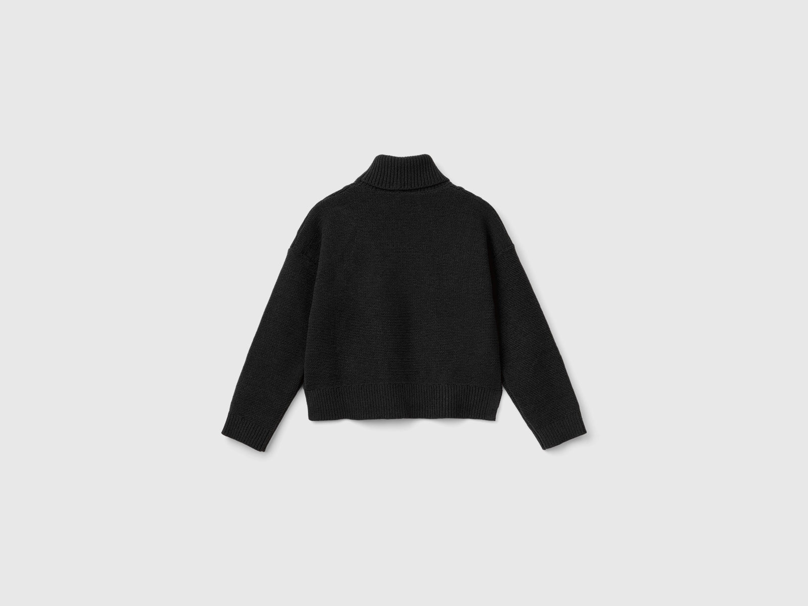 Maglia dolcevita a losanghe da bambina nero 2 | Benetton Outlet