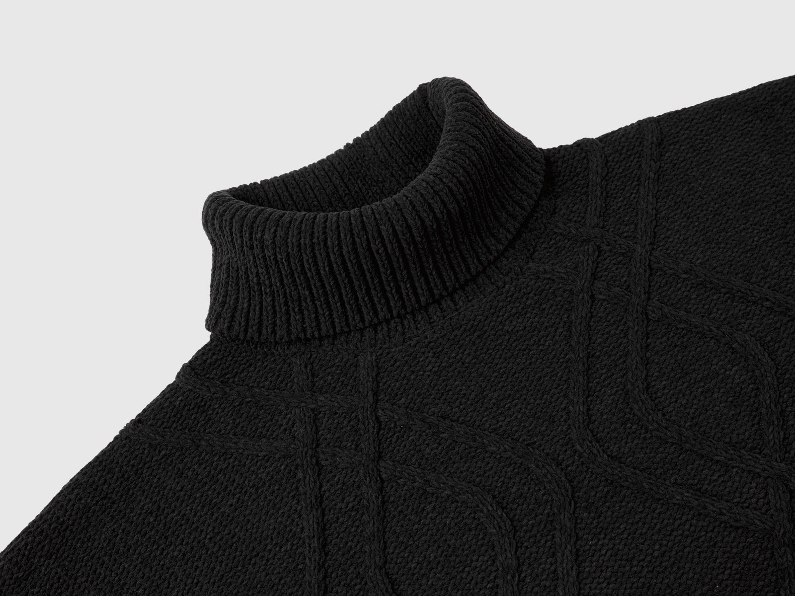 Maglia dolcevita a losanghe da bambina nero 3 | Benetton Outlet